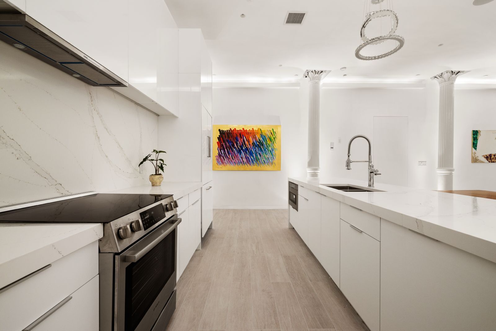 Undisclosed Address Manhattan, NY 10012 - Photo 3 of 12 a kitchen with stainless steel appliances granite countertop a stove a sink and a microwave