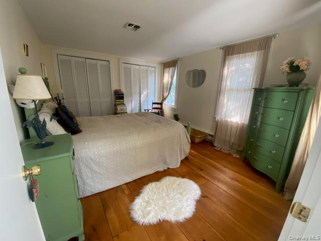 1640-1642 Bulls Head Road Clinton Corners, NY 12514 - Photo 13 of 19 a bedroom with a bed and a mirror