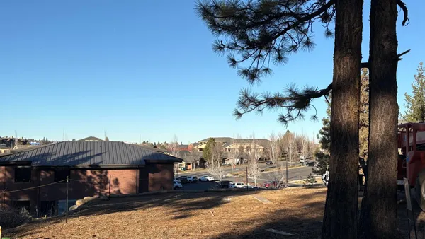 a view of a house with a big yard