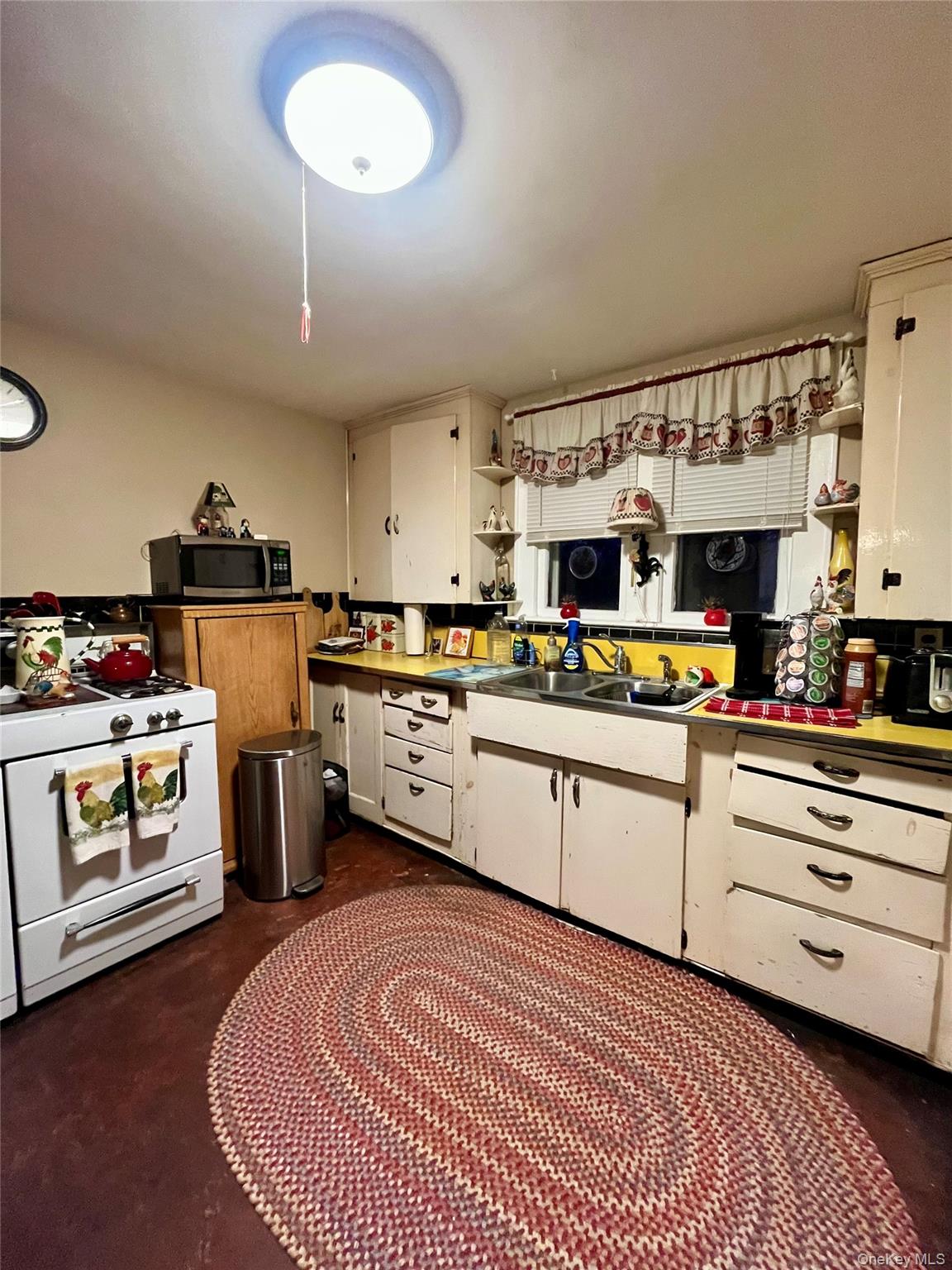 35 Spring Street Goshen, NY 10924 - Photo 9 of 26 a kitchen with stainless steel appliances granite countertop a stove a sink and a refrigerator