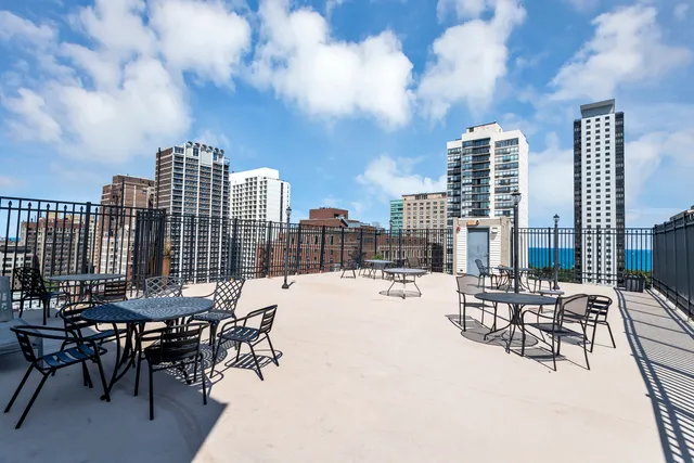 a view of a terrace with furniture and a stove