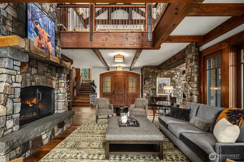 a living room with furniture a fireplace and a table