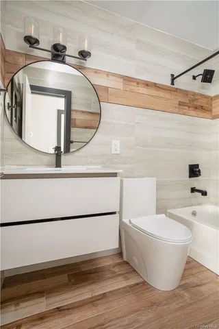 a kitchen with a refrigerator sink and cabinets
