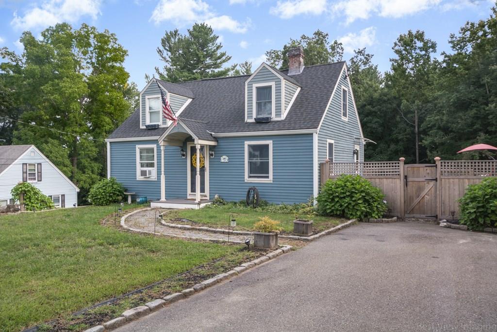 148 Sterling Road Lancaster, MA 01523 - Photo 1 of 39 a front view of a house with a yard