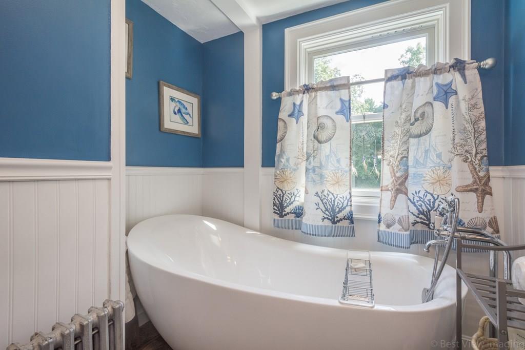 148 Sterling Road Lancaster, MA 01523 - Photo 14 of 39 a white bath tub sitting next to a window