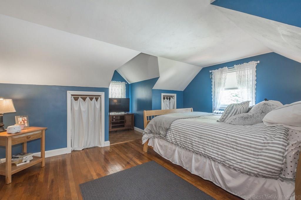 148 Sterling Road Lancaster, MA 01523 - Photo 15 of 39 a bedroom with a bed and a tv on table