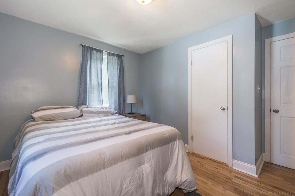 148 Sterling Road Lancaster, MA 01523 - Photo 19 of 39 a bedroom with a bed and wooden floor