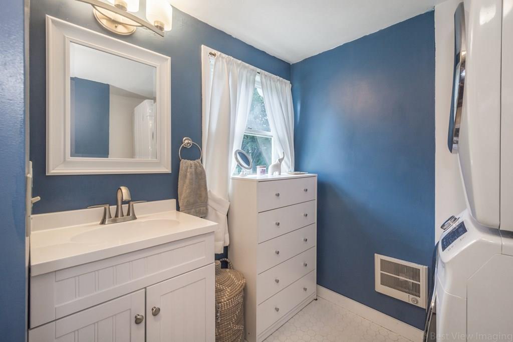 148 Sterling Road Lancaster, MA 01523 - Photo 23 of 39 a bathroom with a sink a mirror and a window