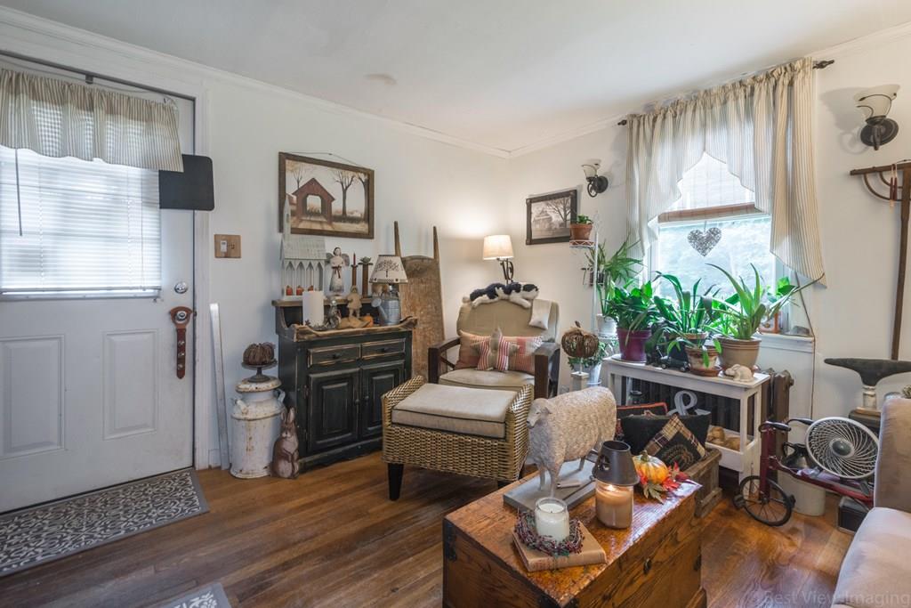 148 Sterling Road Lancaster, MA 01523 - Photo 25 of 39 a living room with furniture fireplace and wooden floor