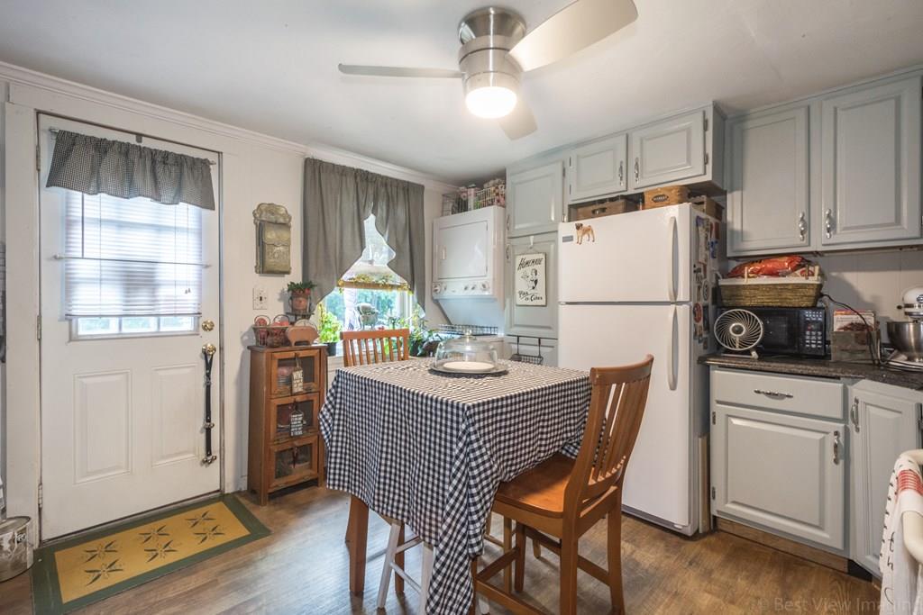 148 Sterling Road Lancaster, MA 01523 - Photo 27 of 39 a view of a kitchen with fridge and wooden floor