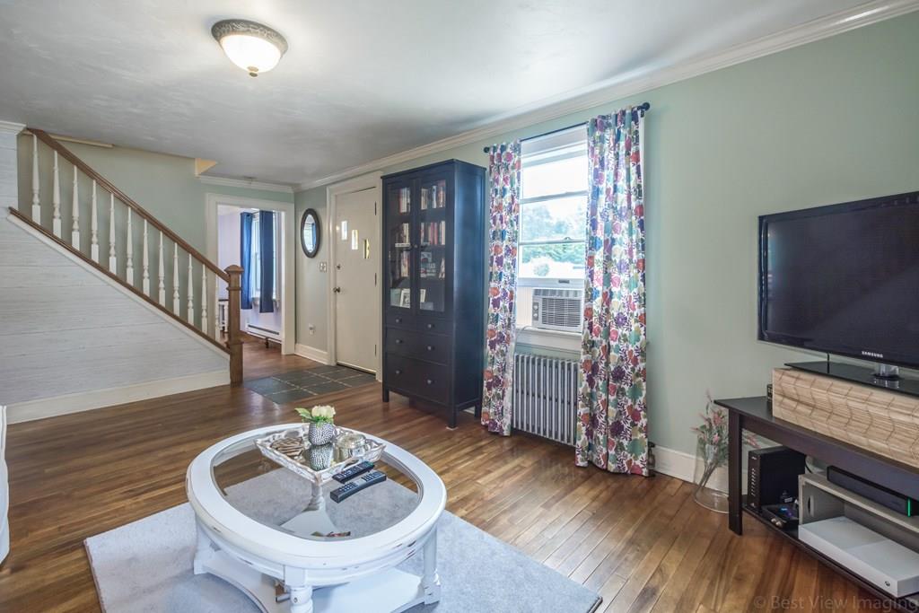 148 Sterling Road Lancaster, MA 01523 - Photo 5 of 39 a living room with furniture and a flat screen tv