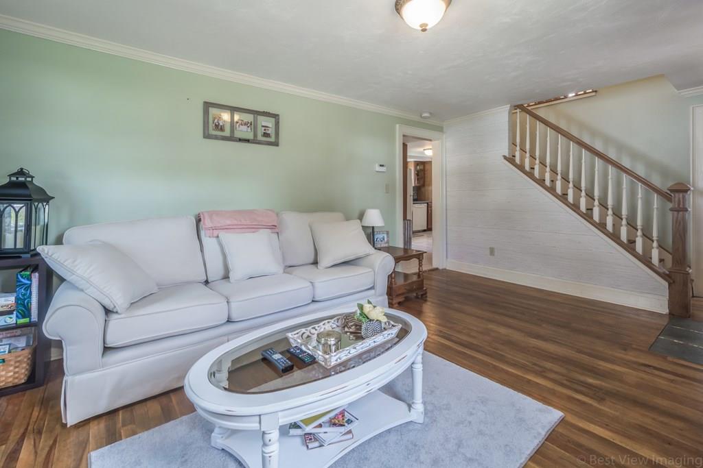 148 Sterling Road Lancaster, MA 01523 - Photo 6 of 39 a living room with furniture and a rug