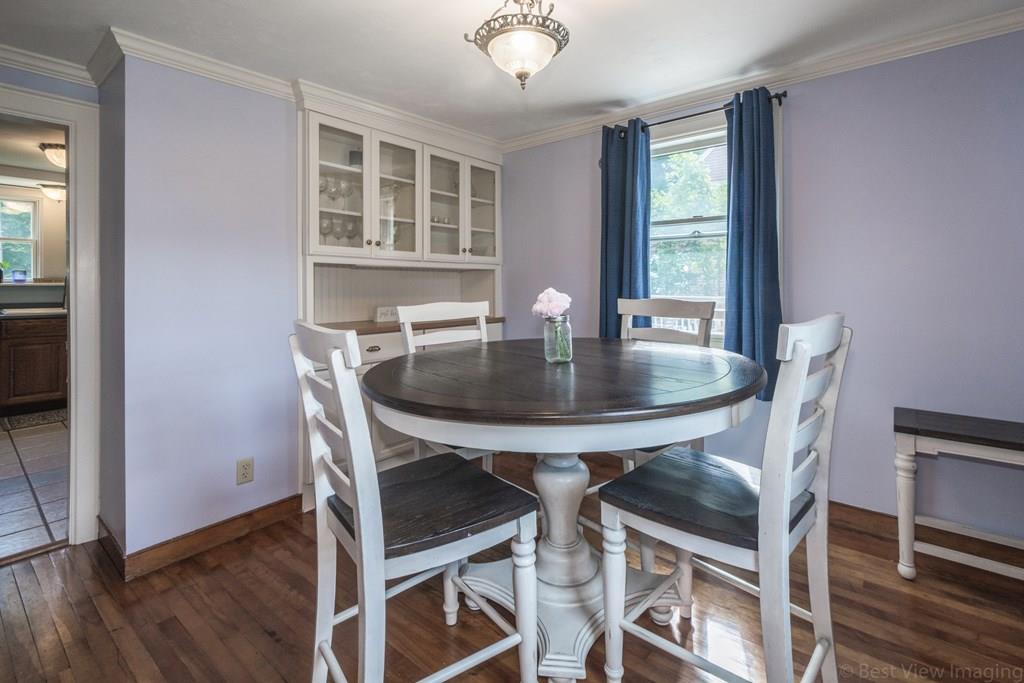 148 Sterling Road Lancaster, MA 01523 - Photo 7 of 39 a view of a dining room with furniture and wooden floor