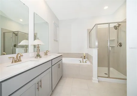 a bathroom with a bathtub and a shower