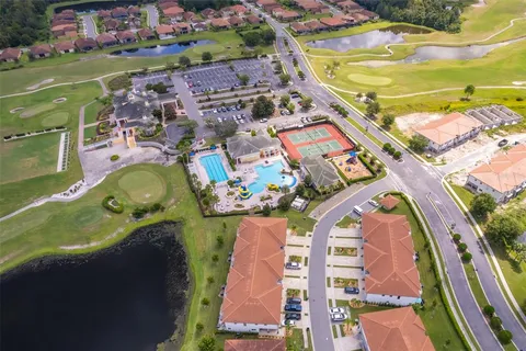 a view of a swimming pool with a yard