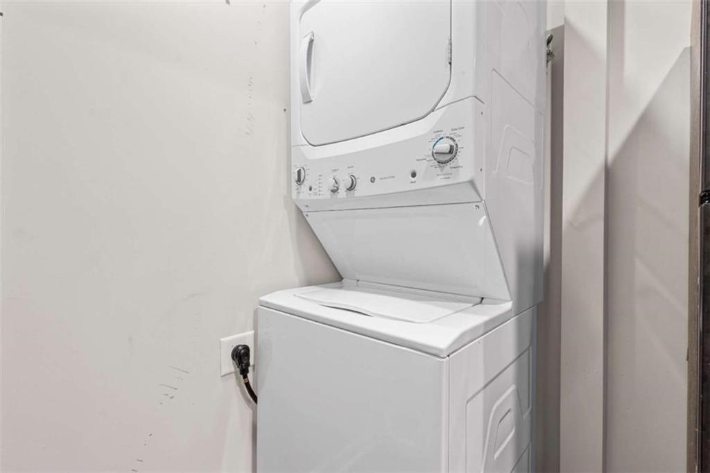 1166 Booth Road, Unit 407 Marietta, GA 30008 - Photo 8 of 18 a utility room with dryer and washer