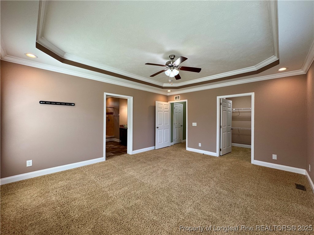 3273 Cameron Hill Road Cameron, NC 28326 - Photo 19 of 36 a view of an empty room with closet and chandelier fan