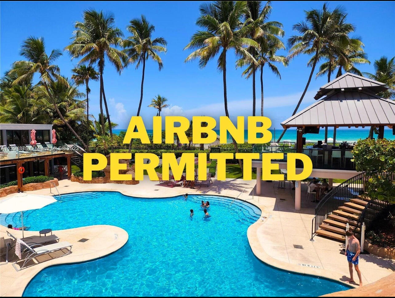 5225 Collins Avenue, Unit 1408 Miami Beach, FL 33140 - Photo 1 of 37 swimming pool with outdoor seating