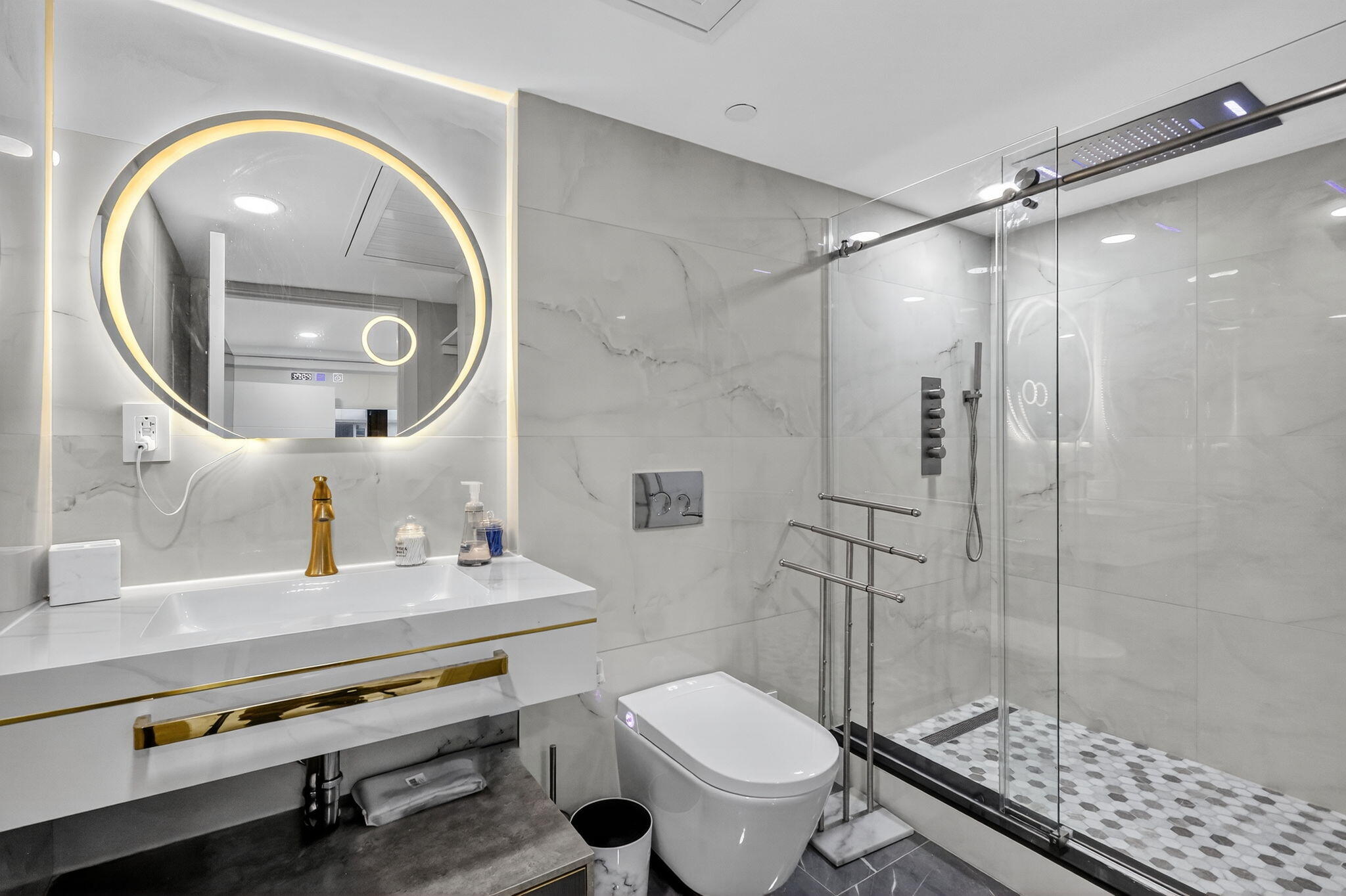 5225 Collins Avenue, Unit 1408 Miami Beach, FL 33140 - Photo 19 of 37 a bathroom with a granite countertop toilet a sink and shower