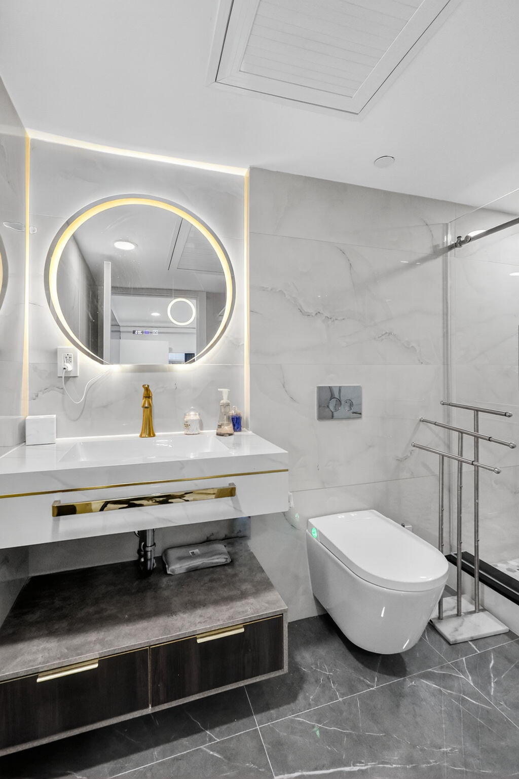 5225 Collins Avenue, Unit 1408 Miami Beach, FL 33140 - Photo 20 of 37 a bathroom with a toilet and a mirror