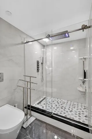 a bathroom with a shower and a sink