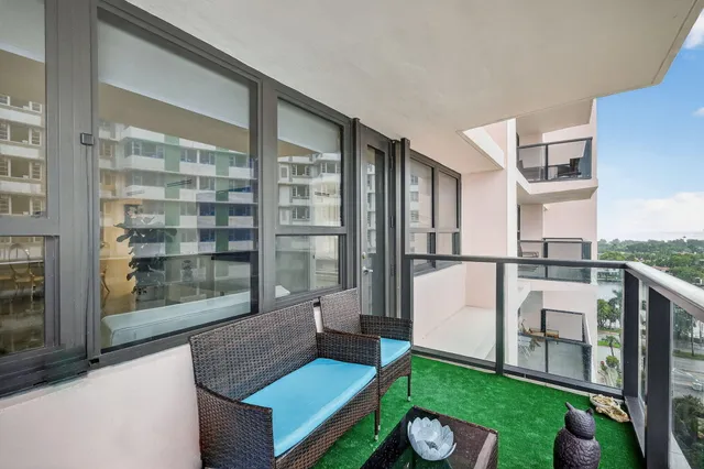 a living room with furniture a window and a fireplace