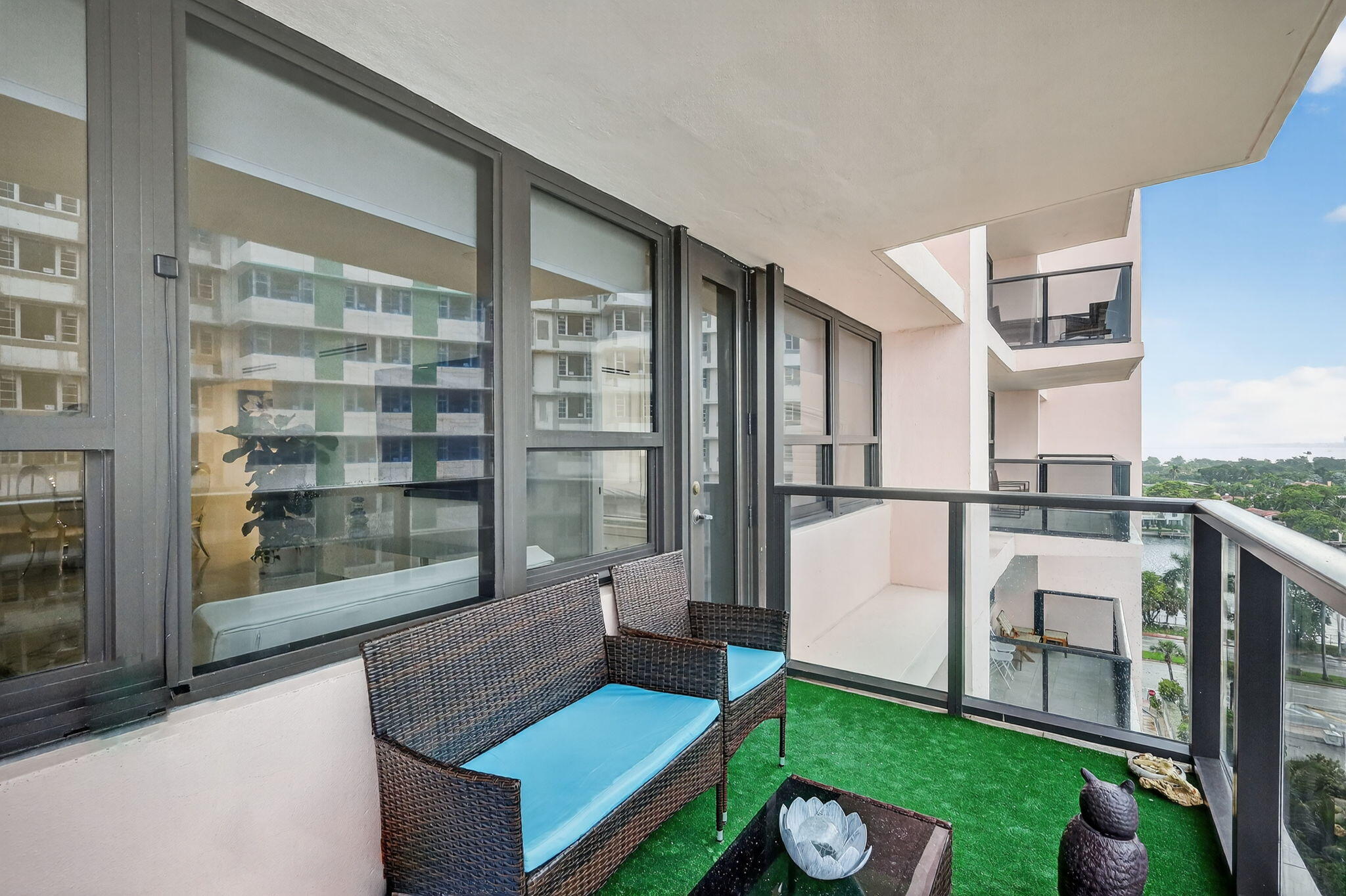 5225 Collins Avenue, Unit 1408 Miami Beach, FL 33140 - Photo 22 of 37 a living room with furniture a window and a fireplace