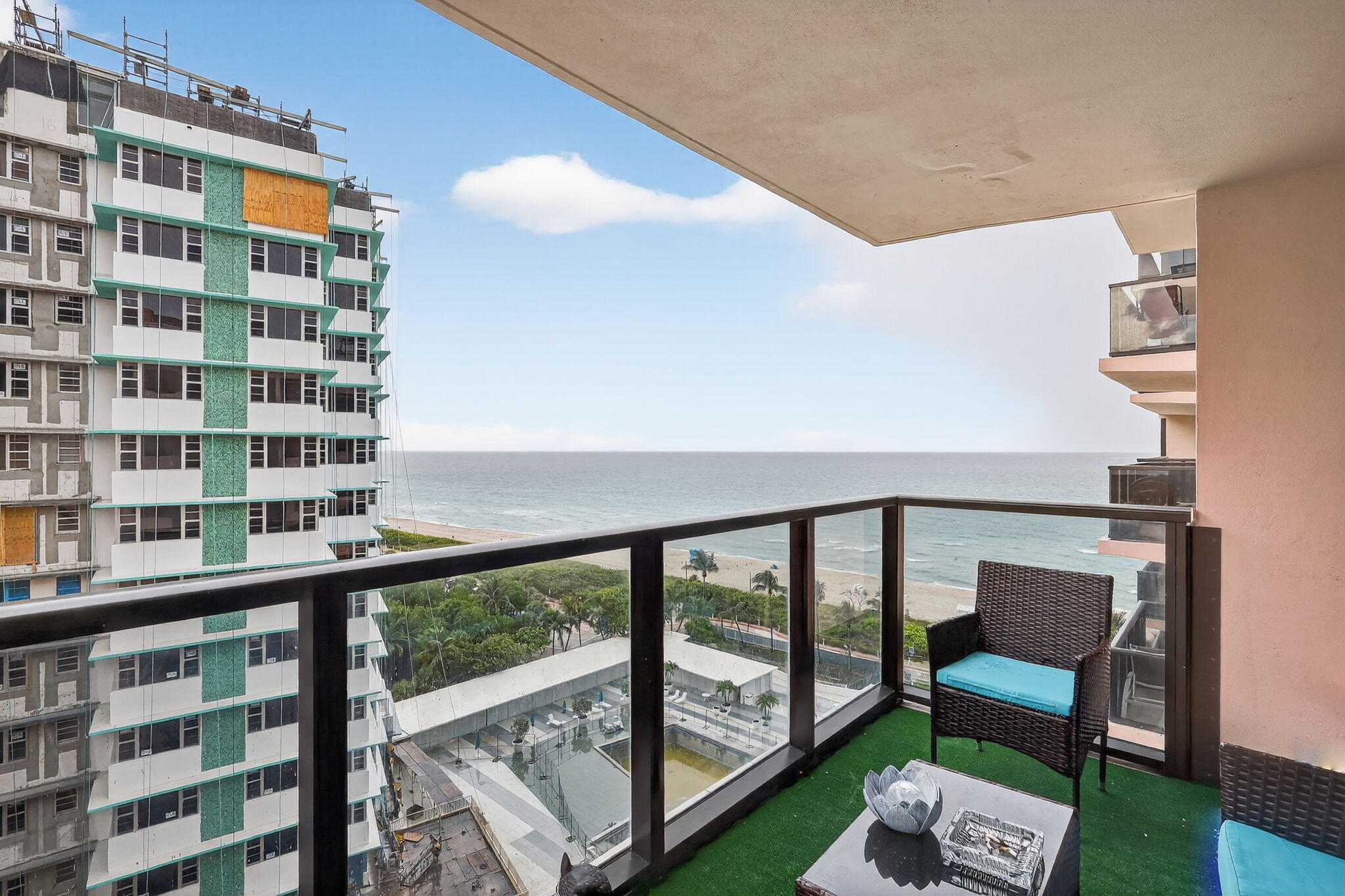 5225 Collins Avenue, Unit 1408 Miami Beach, FL 33140 - Photo 23 of 37 a view of a balcony with chairs