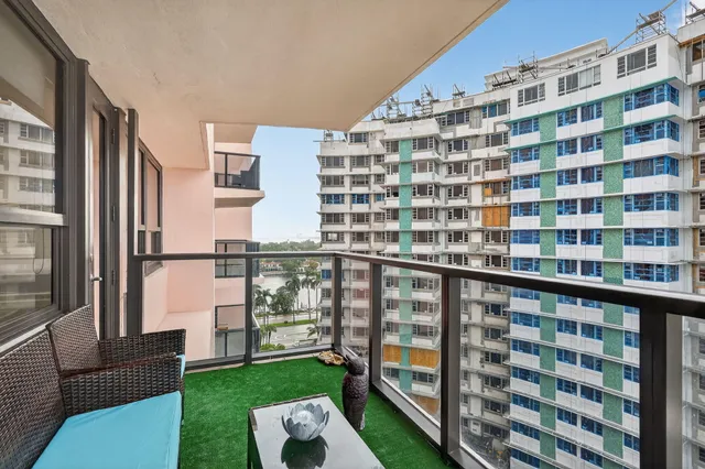 a view of a tall building from the balcony