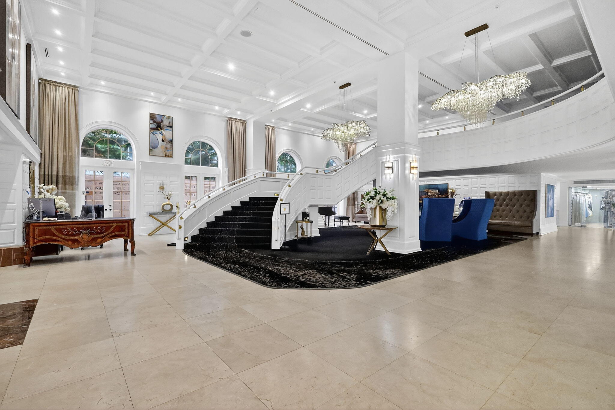 5225 Collins Avenue, Unit 1408 Miami Beach, FL 33140 - Photo 28 of 37 a living room with furniture and a chandelier