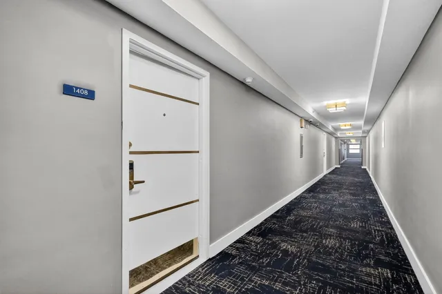 a room with gym equipment and large mirror