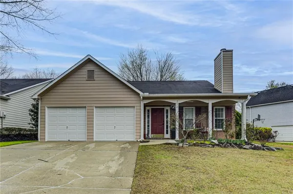 front view of a house with a garden