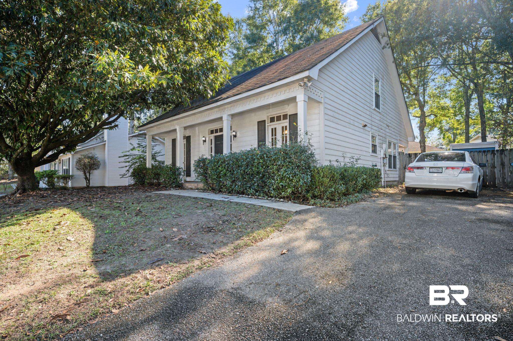 6705 Autumn Ridge Drive Mobile, AL 36695 - Photo 5 of 24 View of front facade featuring a porch