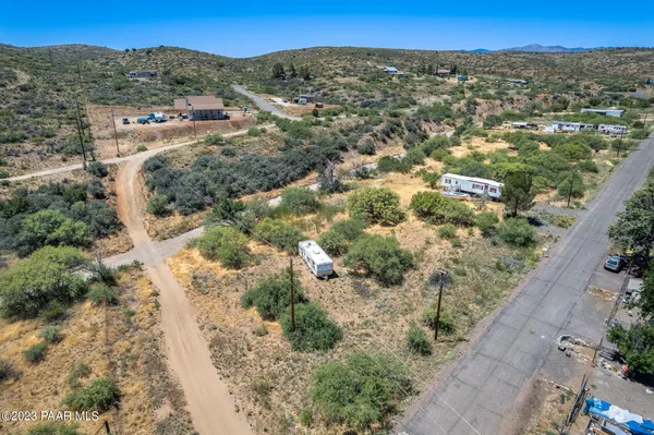 an aerial view of a houses with a yard