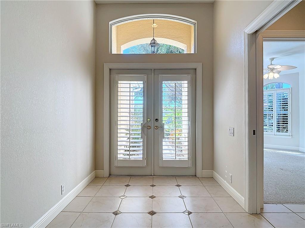 9190 Troon Lakes Drive Naples, FL 34109 - Photo 3 of 50 a view of an entryway with a window