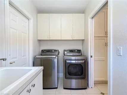a view of a kitchen with washer and dryer
