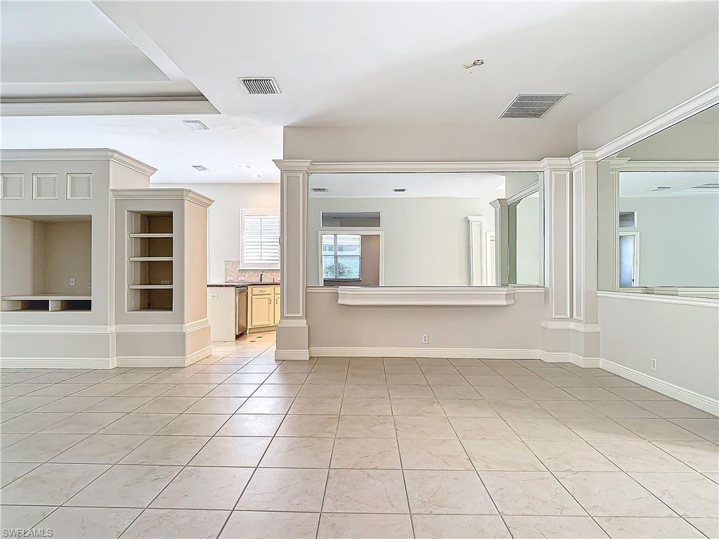 9190 Troon Lakes Drive Naples, FL 34109 - Photo 4 of 50 a view of an empty room