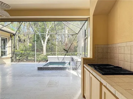 a spacious bathroom with a granite countertop sink and a mirror