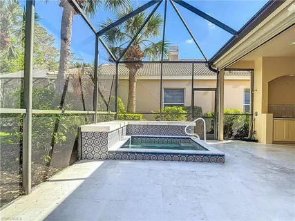 a front view of a house with a garden and yard