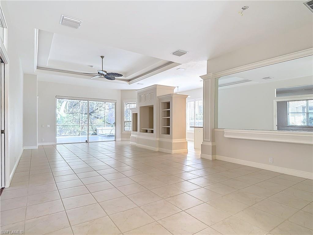 9190 Troon Lakes Drive Naples, FL 34109 - Photo 5 of 50 a view of an empty room with a window