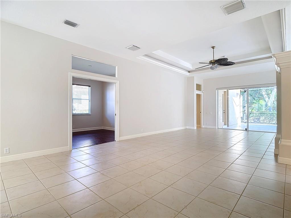 9190 Troon Lakes Drive Naples, FL 34109 - Photo 6 of 50 a view of an empty room with a window