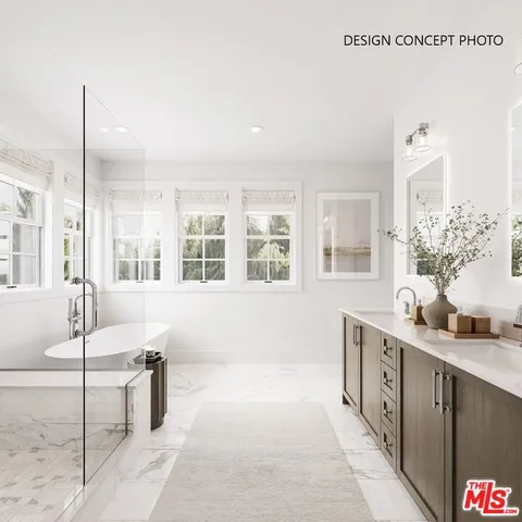 a bathroom with a tub sink and mirror