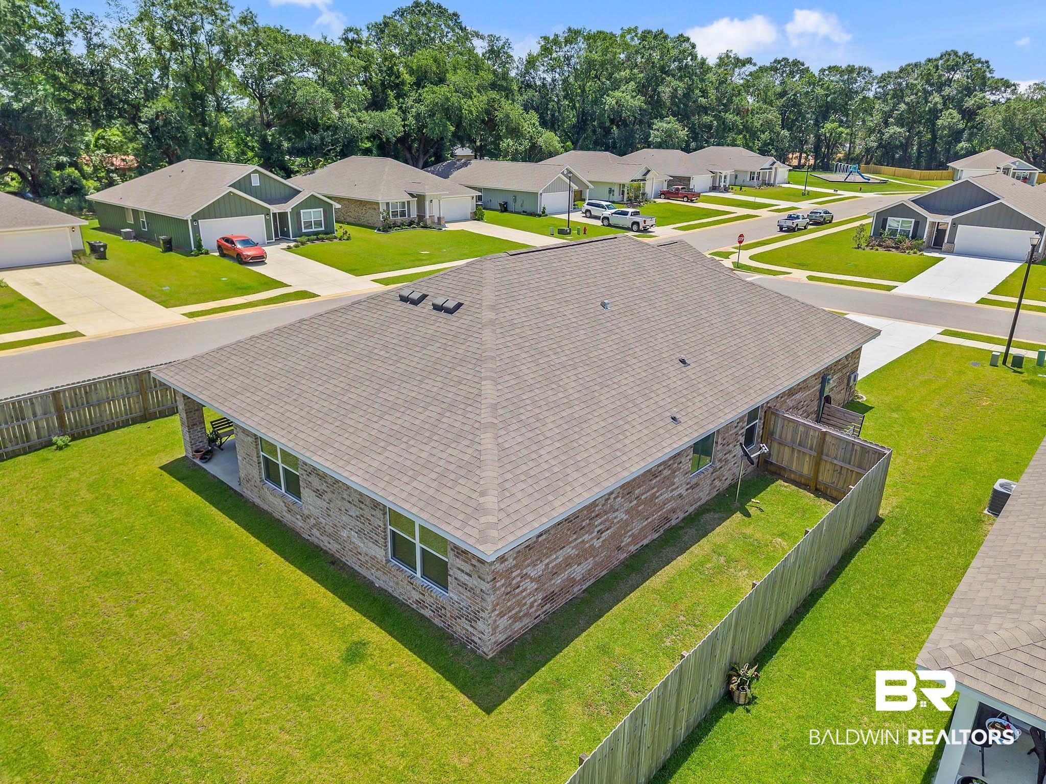 17217 REFLECTION Street Loxley, AL 36551 - Photo 66 of 83 Aerial perspective of suburban area with a tree filled landscape