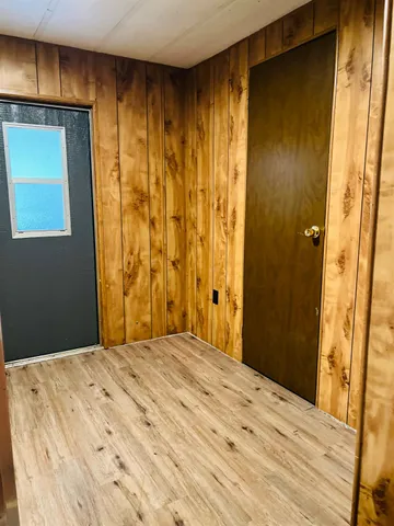 a bedroom with a bed and a mirror