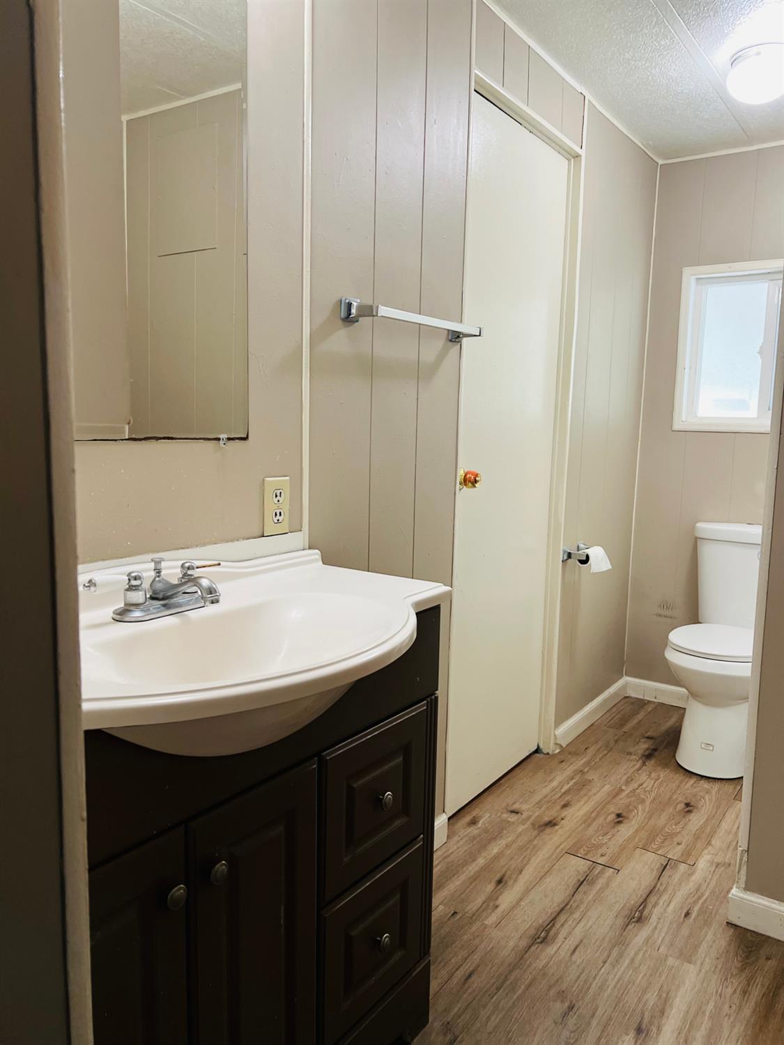 3950 Mack Road, Unit 175 Sacramento, CA 95823 - Photo 10 of 19 a bathroom with a sink a toilet a shower and a mirror
