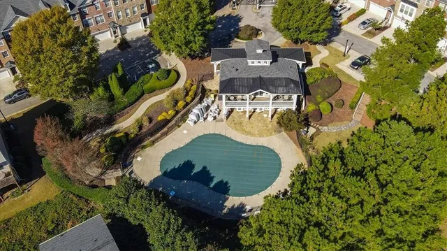an aerial view of residential houses with outdoor space