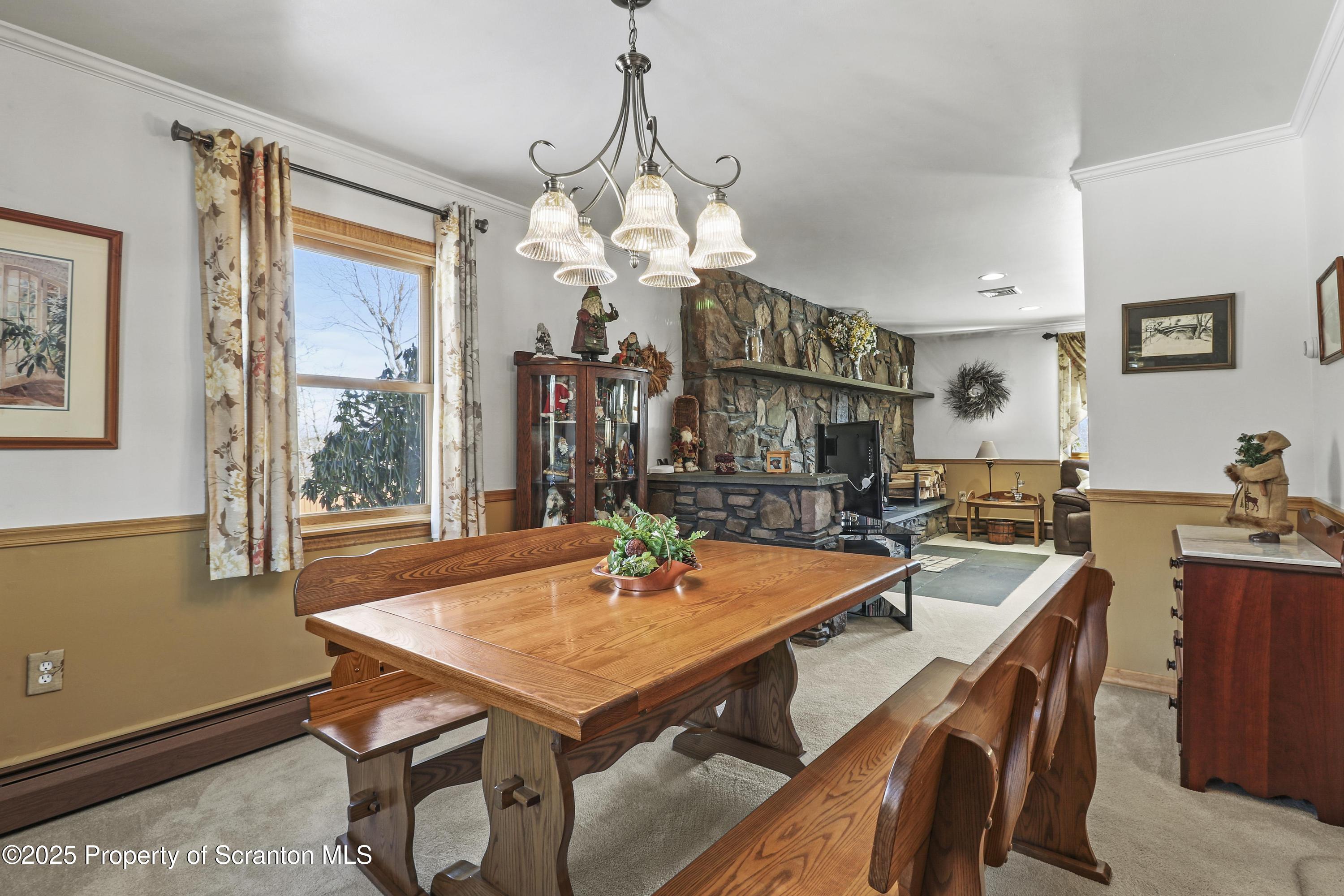 337 Ross Road Dalton, PA 18414 - Photo 12 of 45 a view of a dining room with furniture window and wooden floor