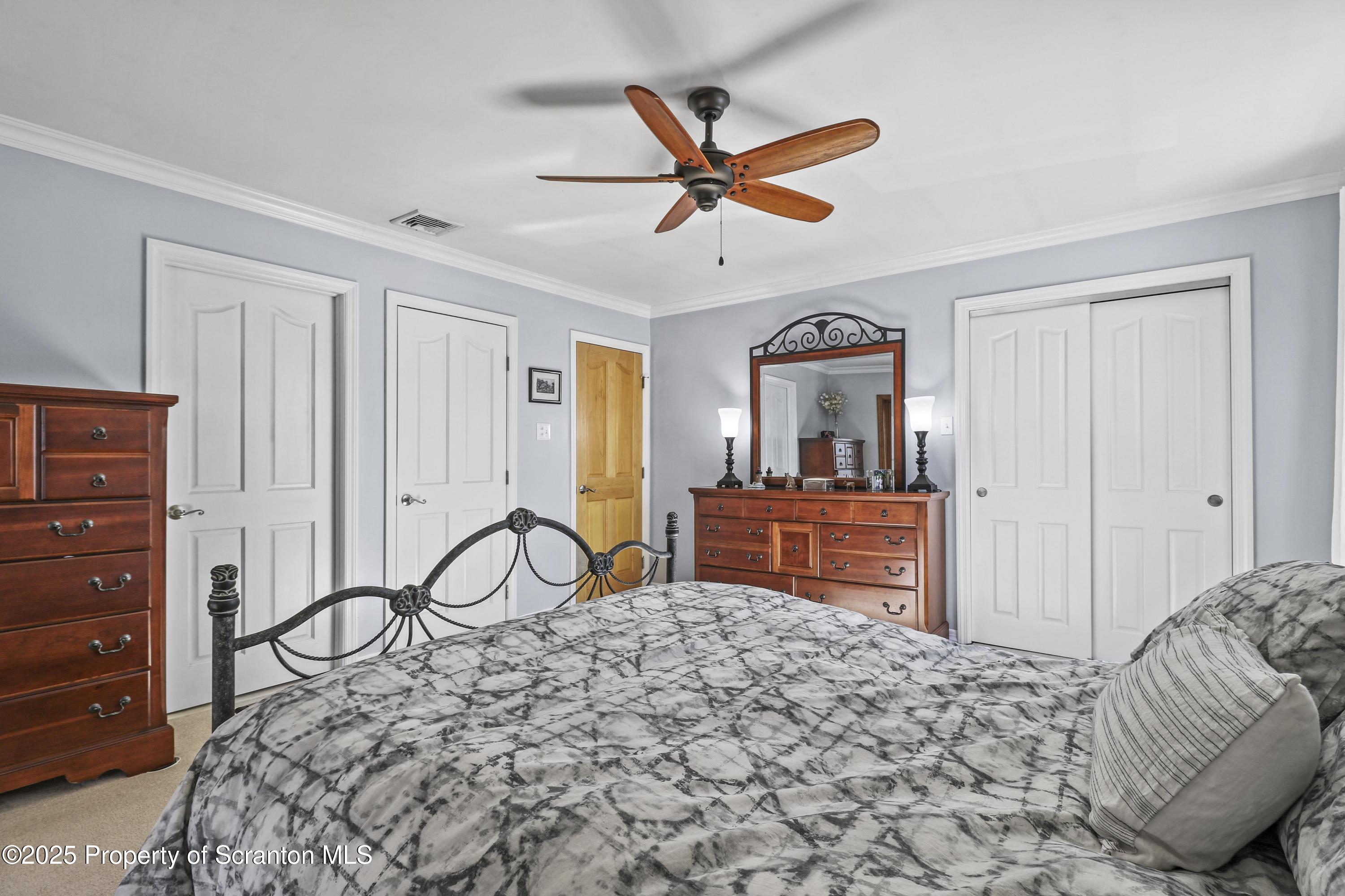337 Ross Road Dalton, PA 18414 - Photo 15 of 45 a bedroom with a bed and a dresser