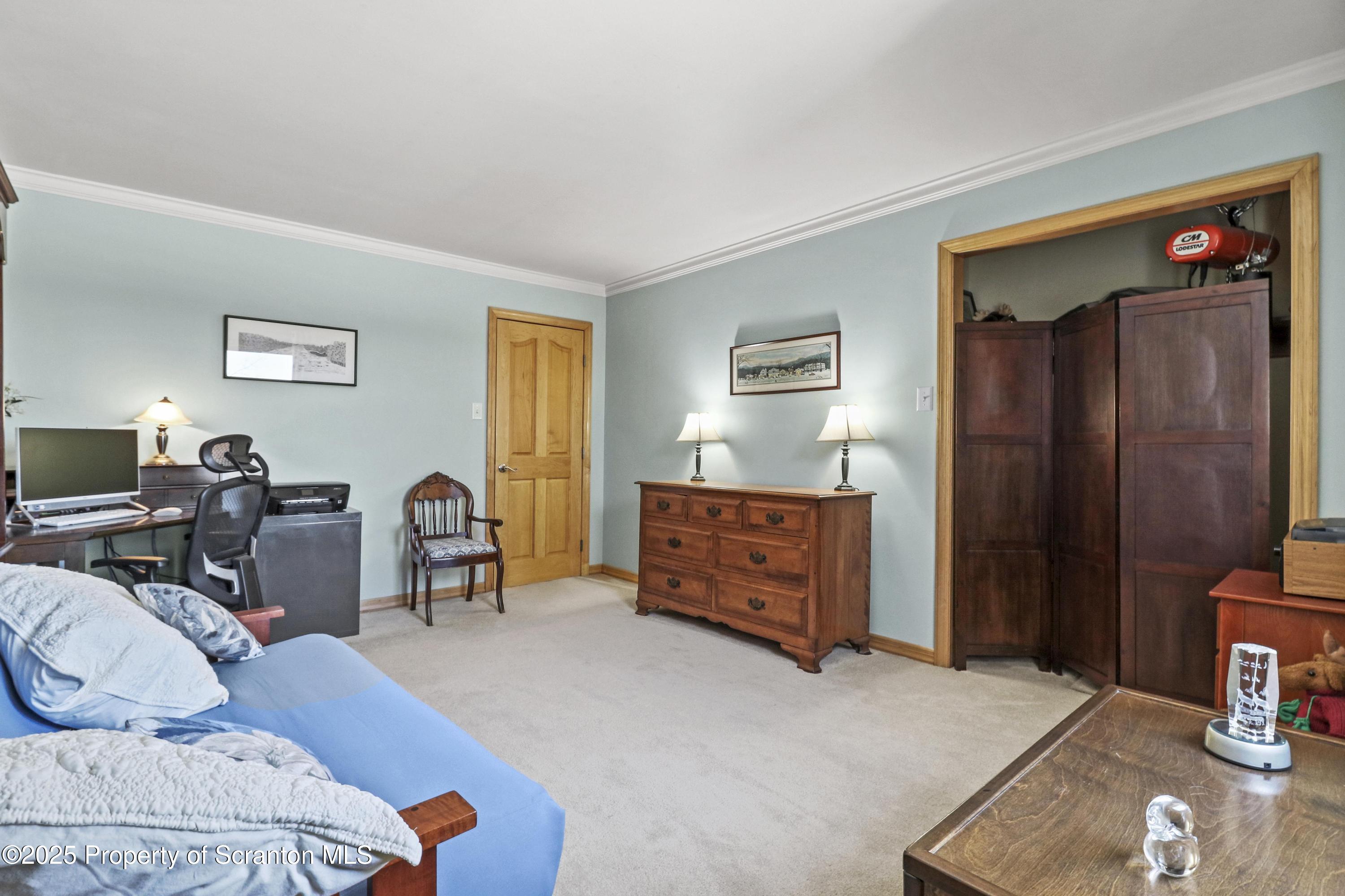 337 Ross Road Dalton, PA 18414 - Photo 19 of 45 a bed room with furniture and a window