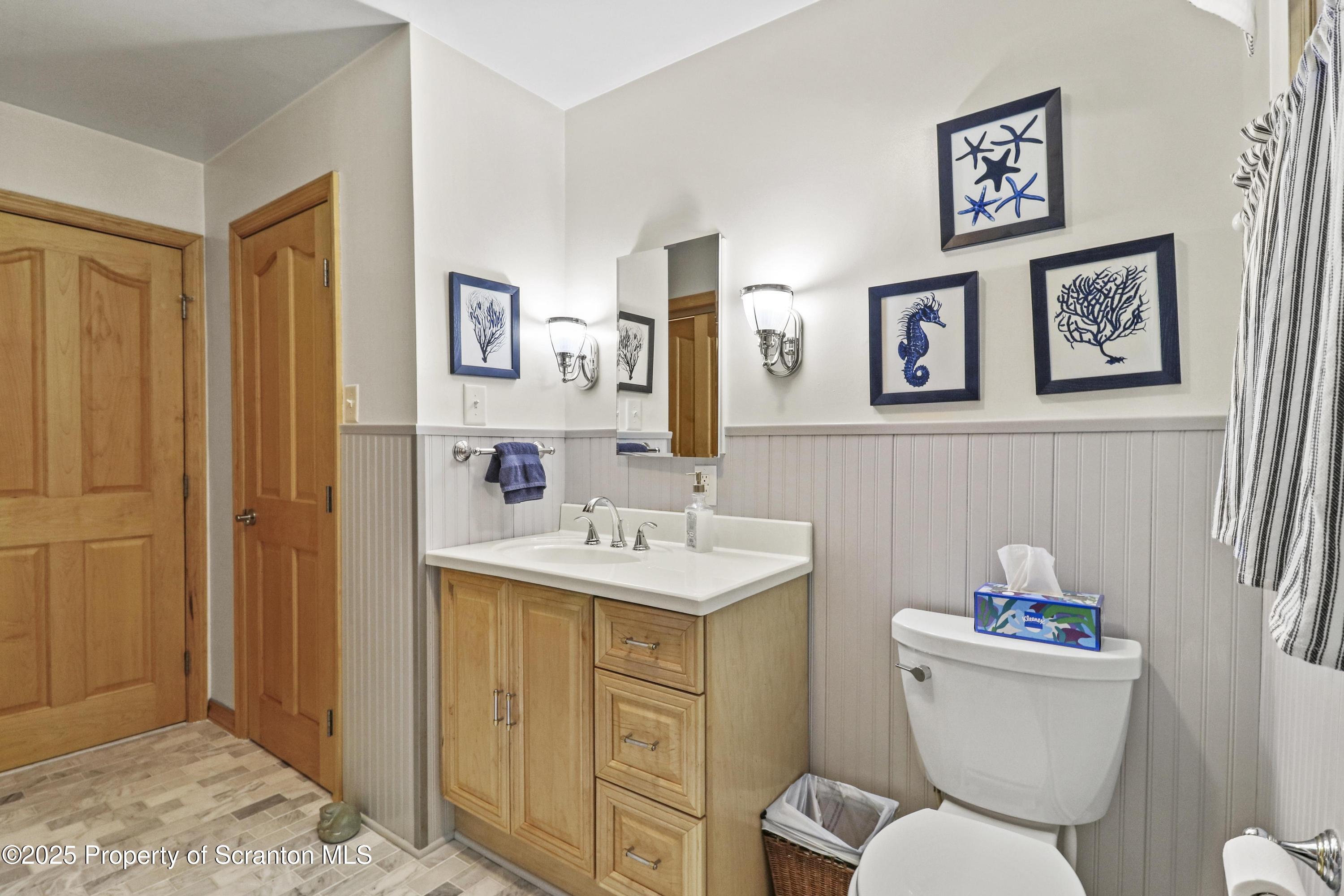 337 Ross Road Dalton, PA 18414 - Photo 22 of 45 a bathroom with a toilet sink and mirror